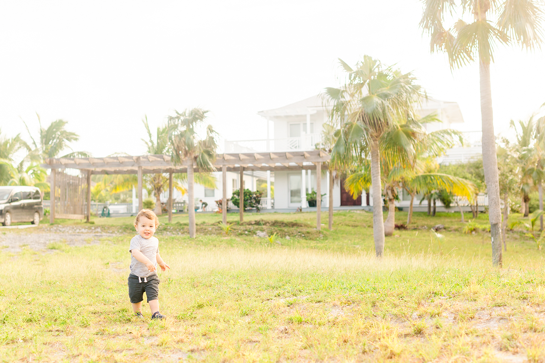 Boy-runs-in-grass-in-caribbean