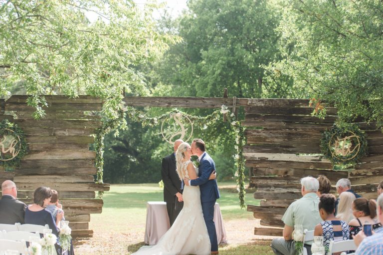 first-kiss-after-ceremony-cedar-bend-cedar-creek-wedding