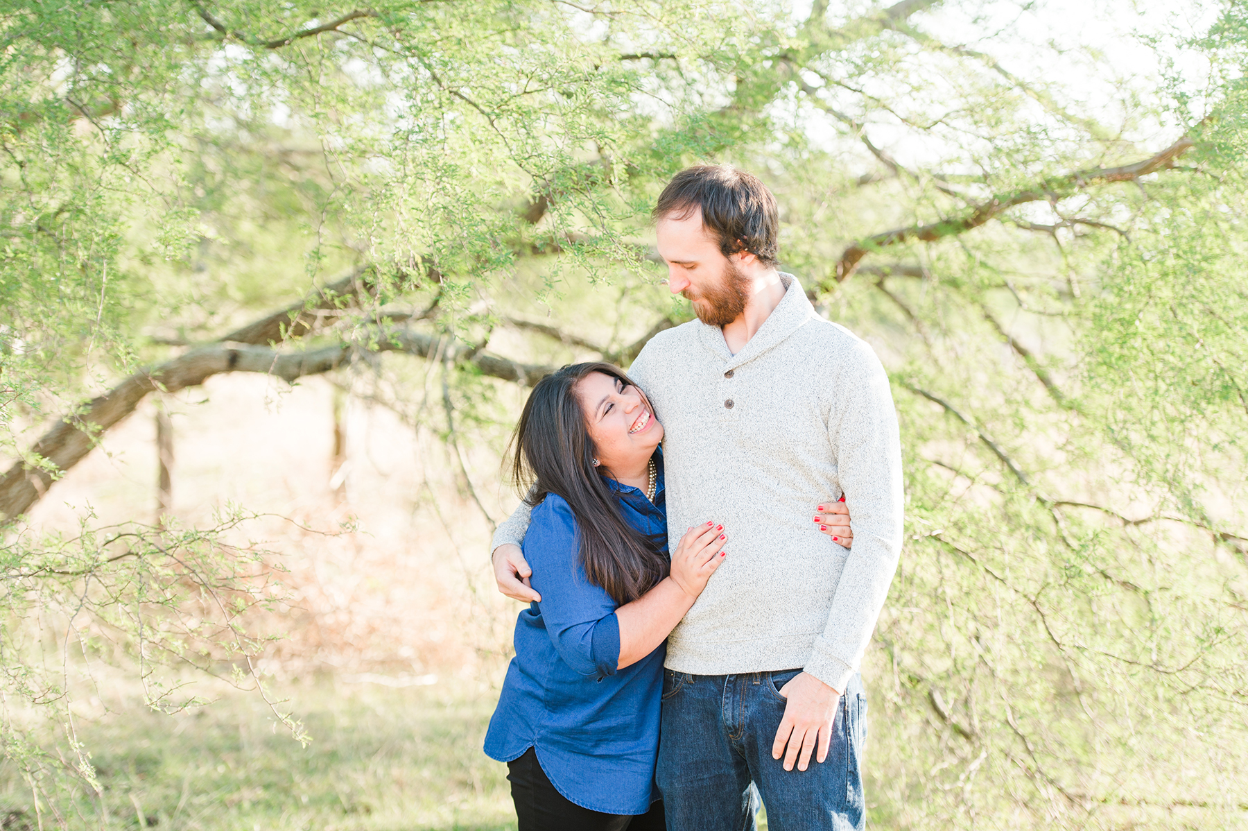 green-hill-country-trees-engaged-couple-austin