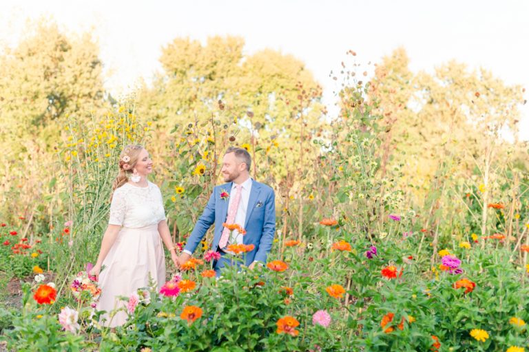 austin-wedding-photographer-bride-groom-walk-in-flowers