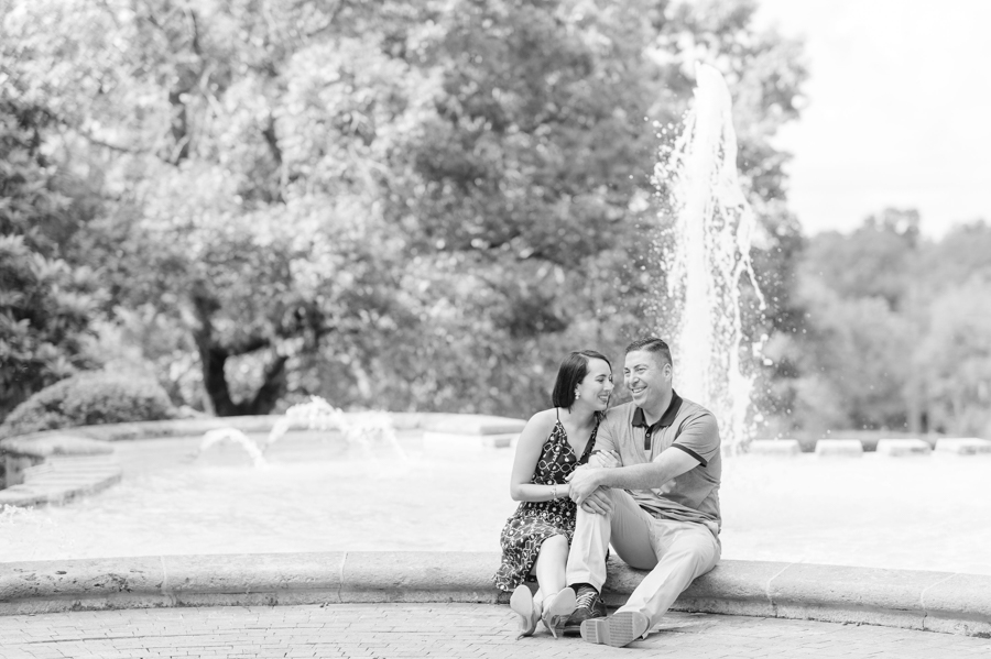 McKay-Art-Museum-fountain-engaged-couple-sits-on-edge