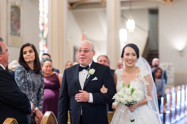 bride-smiles-walking-down-aisle-st-josephs-catholic-church-wedding-san-antonio