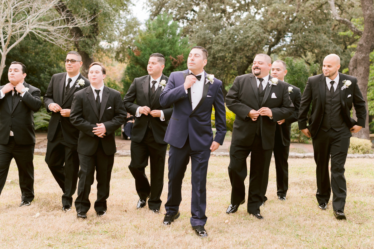 groomsmen-adjust-bow-ties-southwest-school-art-wedding