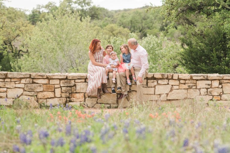 family-sits-stone-wall-reimers-ranch-dripping-springs