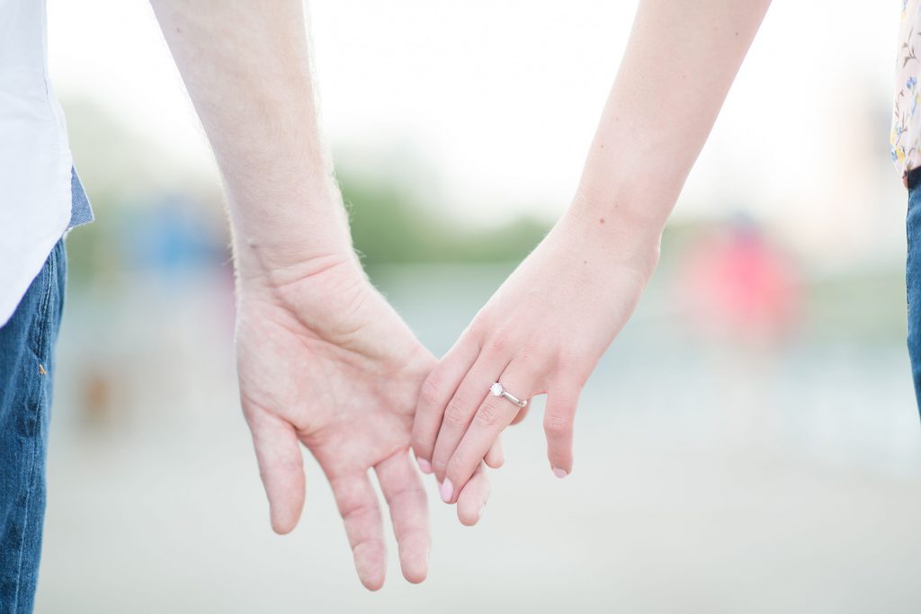 Couple-holding-hands-close-up-ring-shot-austin-engagement-photographer