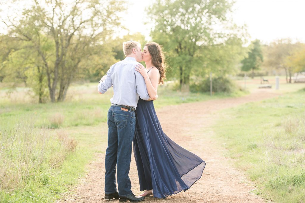Engagement-photography-kissing-field-before-Austin-wedding
