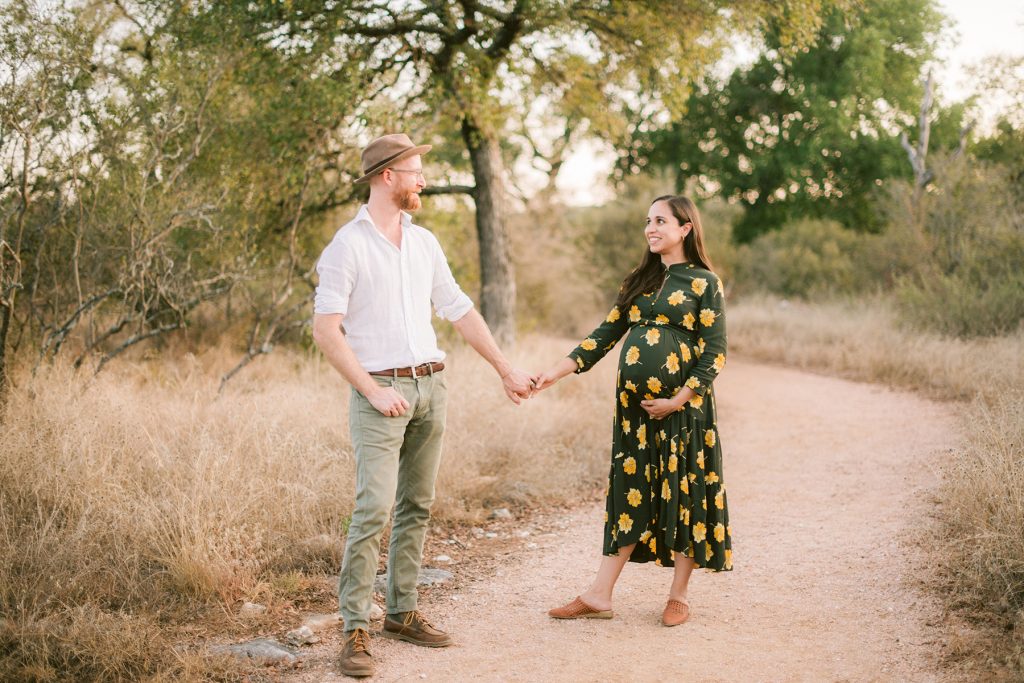 pregnant-couple-on-path-hill-country-austin