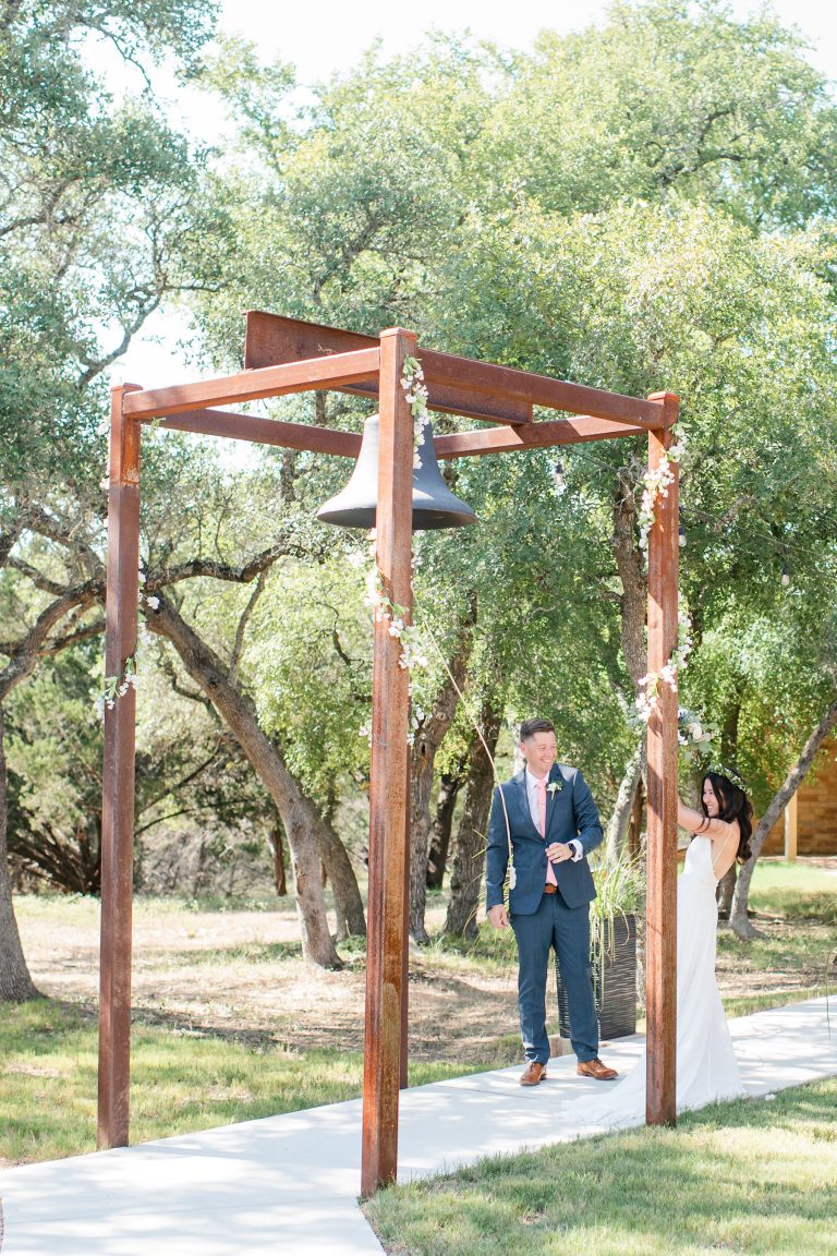 prima-vista-ring-bell-after-ceremony-hill-country-wedding
