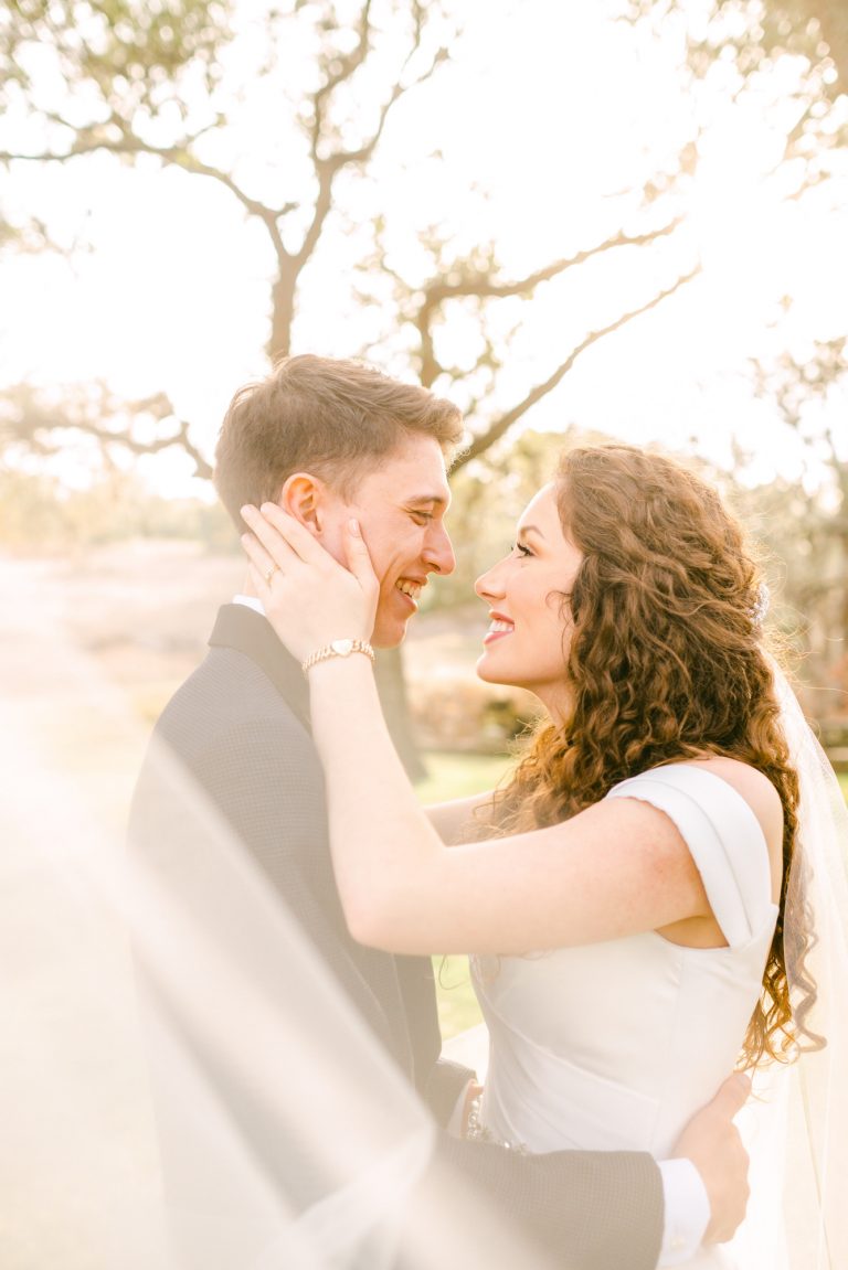 veil-around-bride-groom-austin-texas-wedding-photographer-addison-grove
