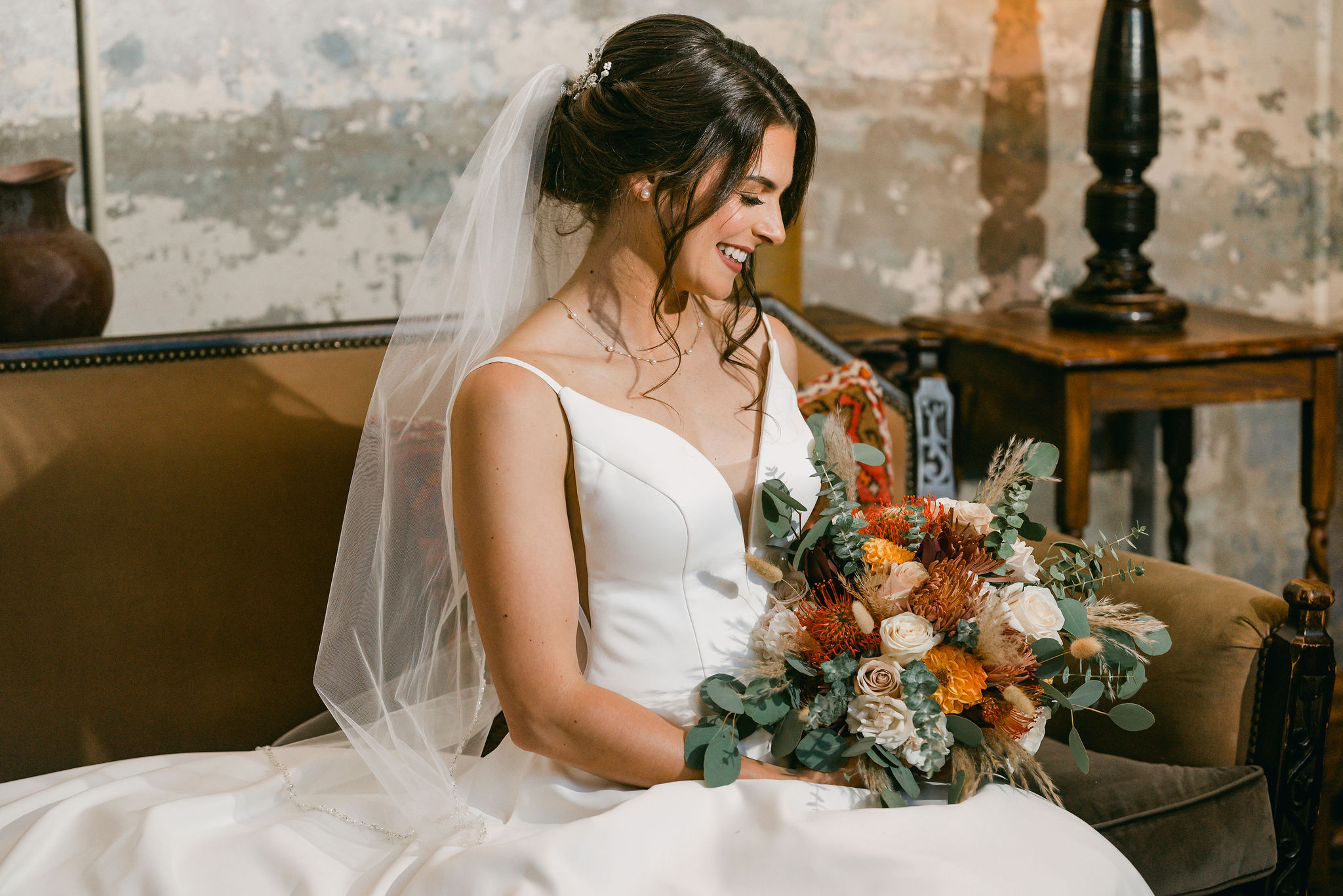 austin-wedding-photographer-hotel-emma-bride-holds-bouquet