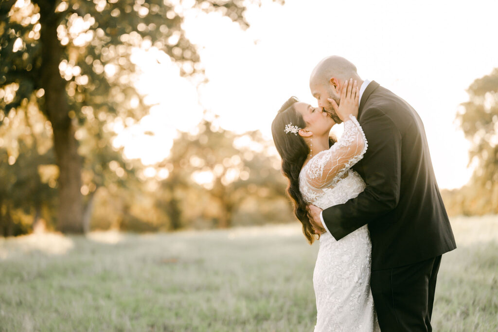 Bride-groom-kiss-sunset-Lockhart-wedding