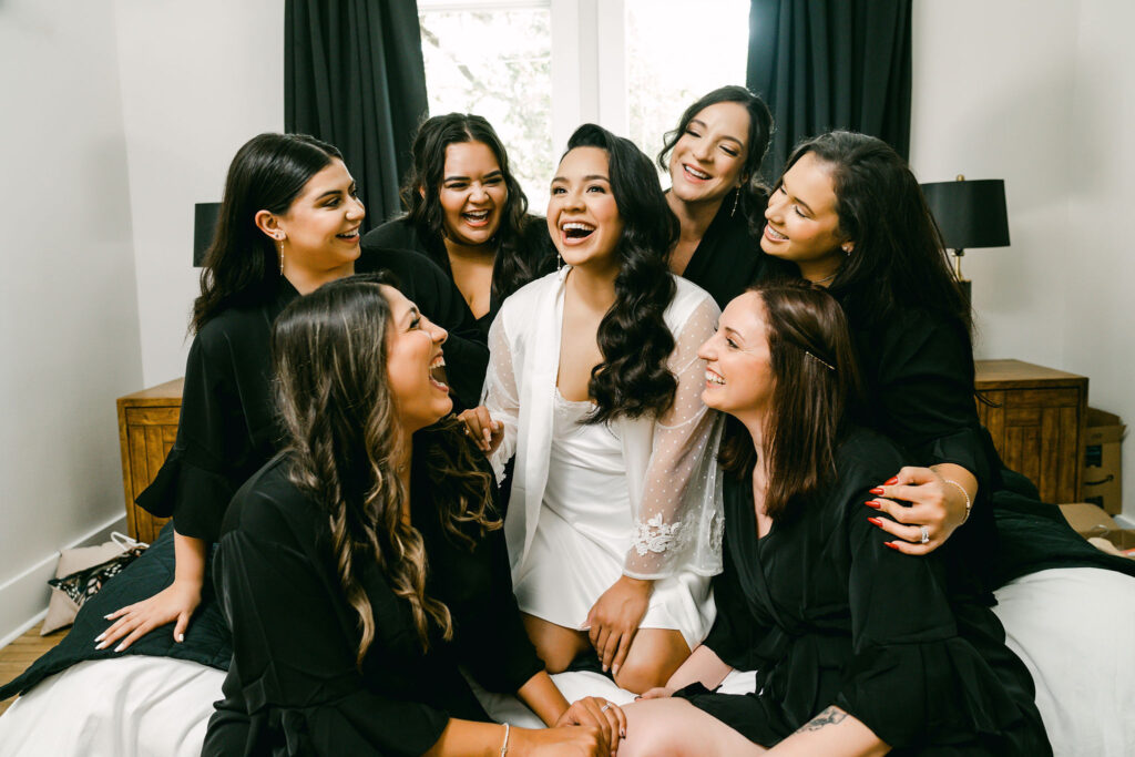 Bride-laughing-bridesmaids-Dripping-Springs-weddings