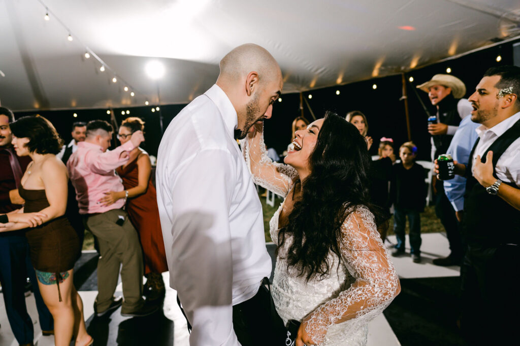 Austin-bride-groom-laughing-together-dancing-reception