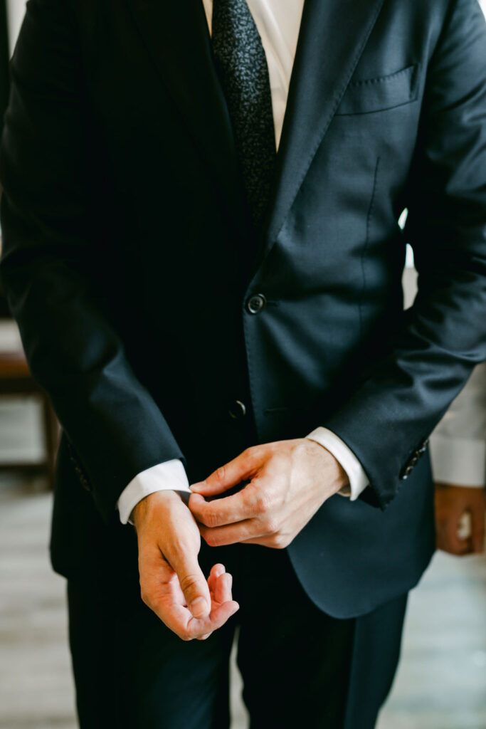 Groom-getting-ready-black-suit