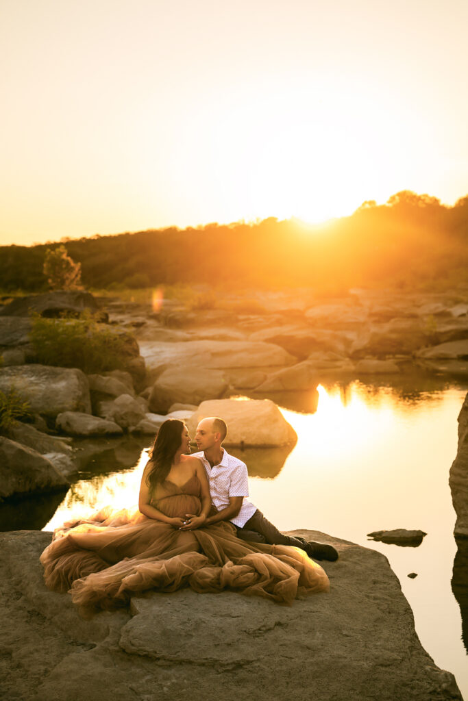 Couple-sitting-over-rocks-pedernales-austin-family-photography