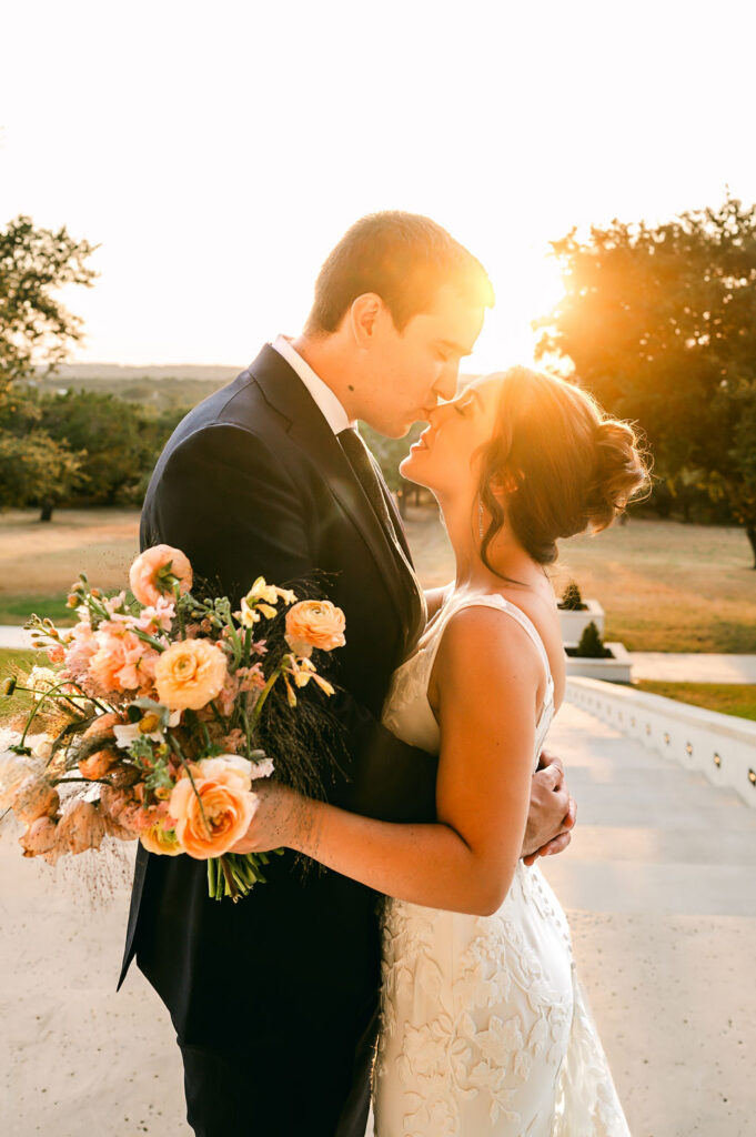 couple kiss during sunset