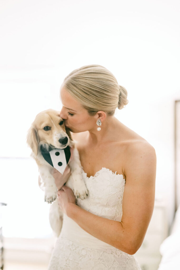 bride-kisses-her-dog-after-getting-into-wedding-dress