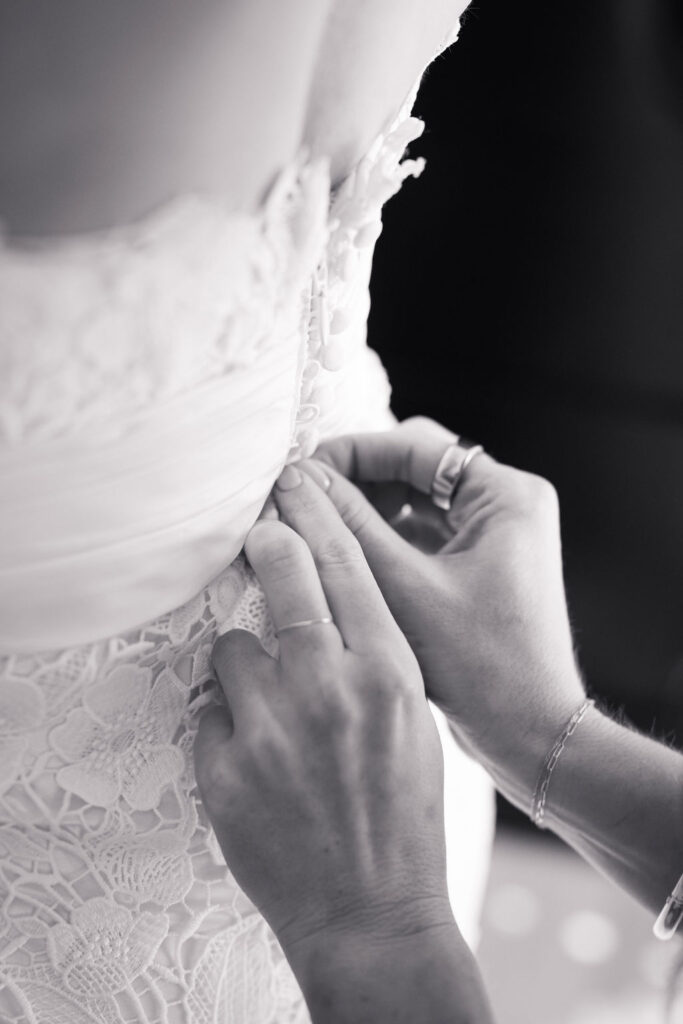 Dress-getting-buttoned-The-Allen-House-Austin-weddings