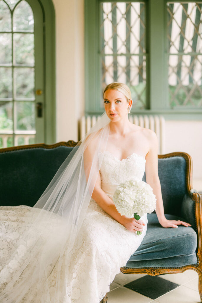 Bride-sitting-couch-inside-Laguna-Gloria-Austin-weddings