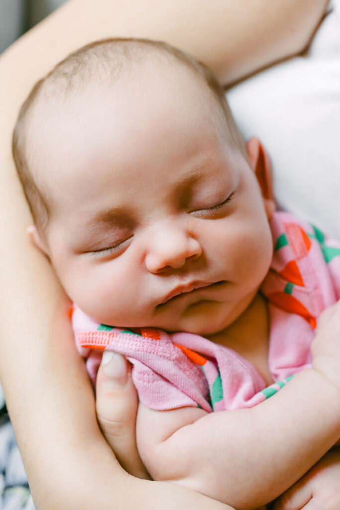 Family cuddles and snuggles captured by an Austin lifestyle photographer during a newborn session