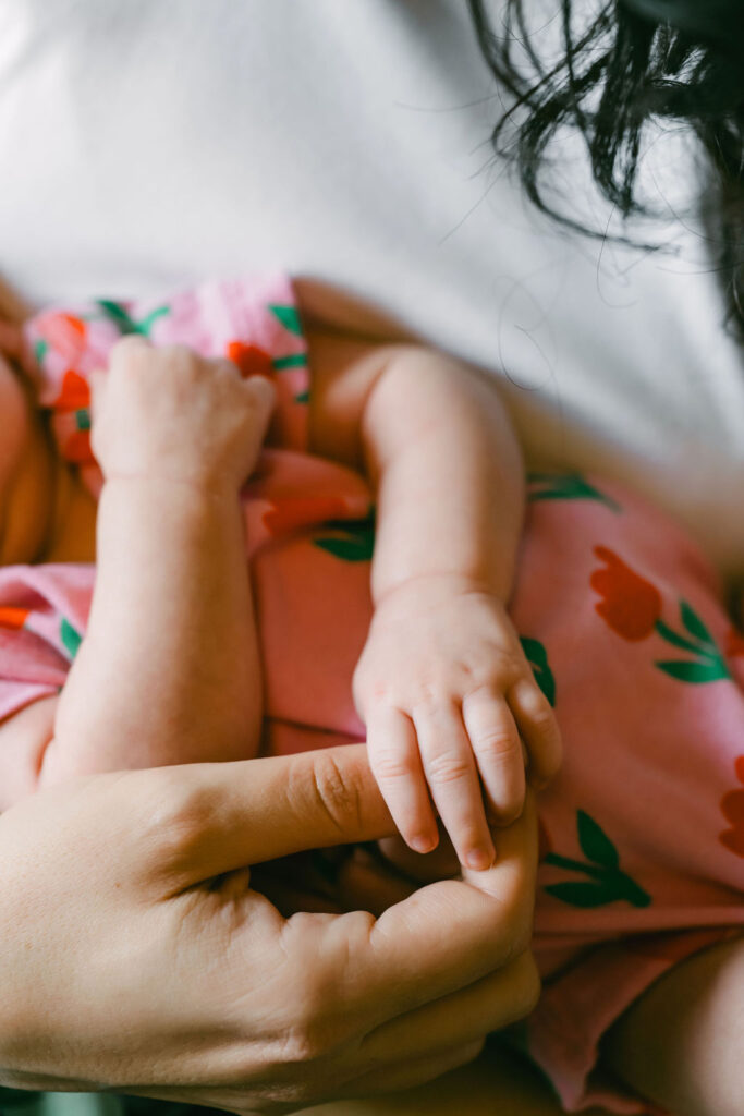 Austin lifestyle photographer capturing newborn hands and quiet morning moments at home