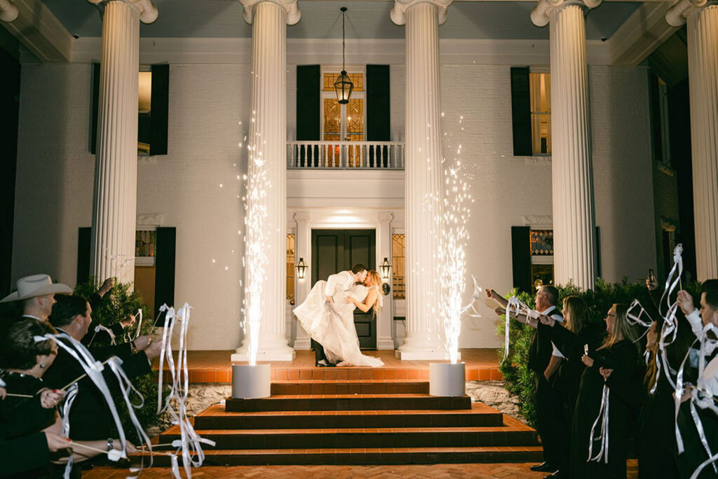 Cold Sparks at Woodbine Mansion in Austin while bride and groom kiss