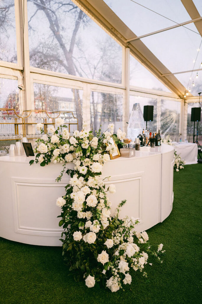 Stunning floral arrangement inside reception tent at Woodbine Mansion in Austin