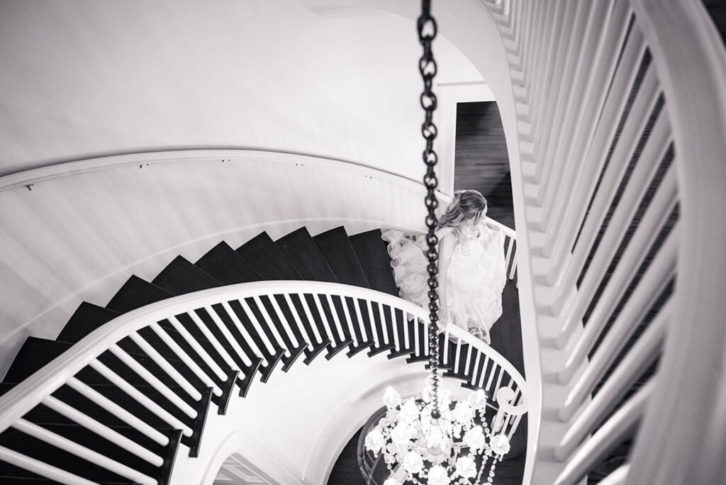 Staircase at Woodbine Mansion with bride walking down for first look