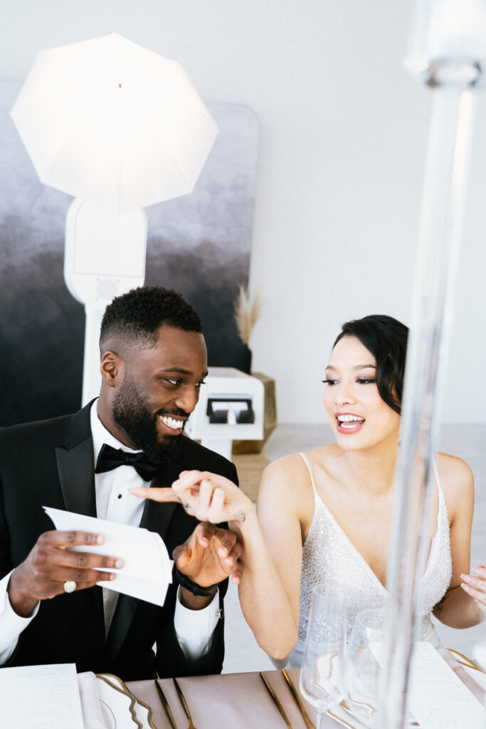 couple looking through photos printed out
