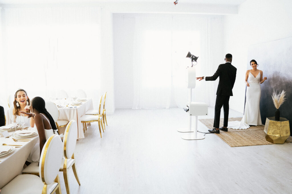couple setting up to take photos using the photo booth