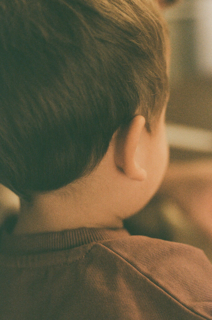 film photo of the back of a child's head